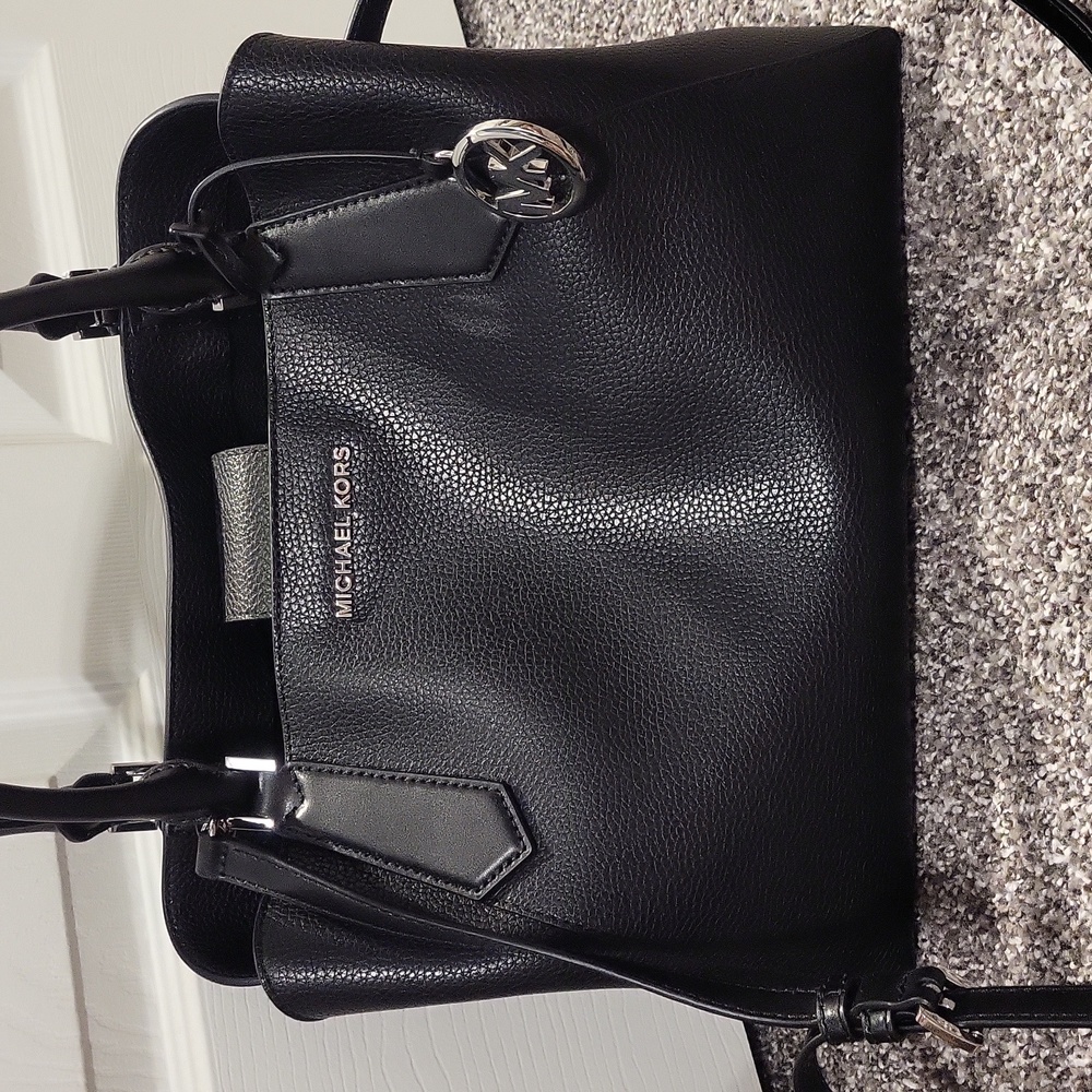 Michael Kors Black and silver purse.